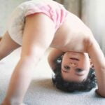 Baby bending over